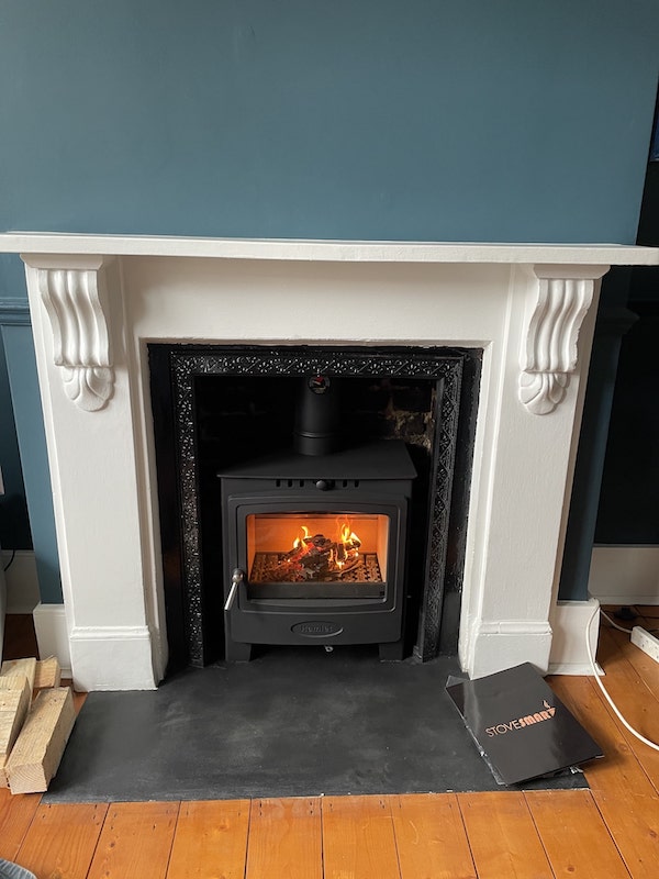 Wood burner in fireplace