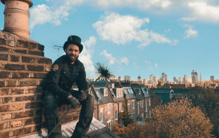 Chimney sweep on rooftop
